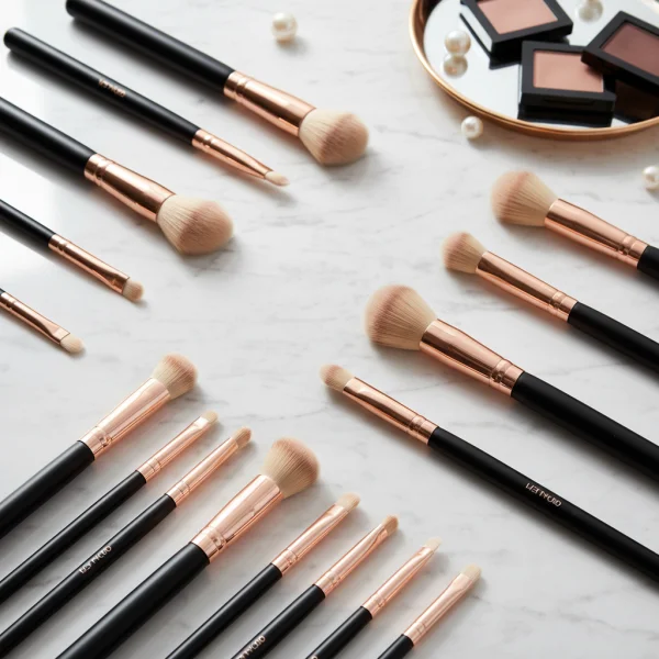 Makeup brushes arranged neatly on white... 1